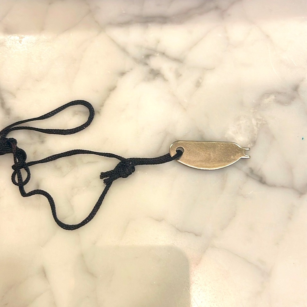 Key to Tumi leather clutch